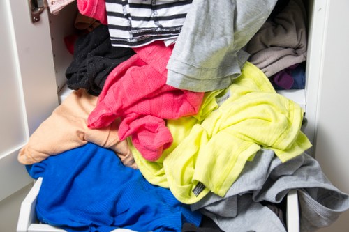 Supervisor conducting a site risk assessment amid overgrown garden